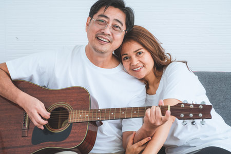 Happy Asian senior couple having good time at home. Old people retirement and healthy citizens elderly concept.の写真素材