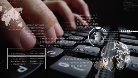 Man working on laptop computer keyboard with graphic user interface GUI hologram showing concepts of...