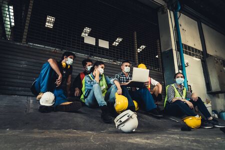 Factory shutdown due to outbreak of Coronavirus Disease 2019 or COVID-19. Concept of economic crisis, people unemployment and productionの写真素材