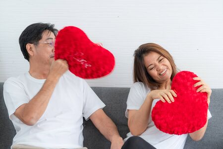 Happy Asian senior couple having good time at home. Old people retirement and healthy citizens elderly concept.の写真素材