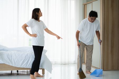 Asian senior couple cleaning bedroom floor. Retirement and healthy elderly concept.の写真素材