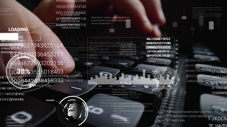 Man working on laptop computer keyboard with graphic user interface GUI hologram showing concepts of...