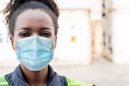 Factory workers with face mask protect from outbreak of Coronavirus Disease 2019 or COVID-19....