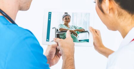 Doctor telemedicine service online video for virtual patient health medical chat . Remote doctor healthcare consultant from home using online mobile device connect to internet for live video call .の写真素材