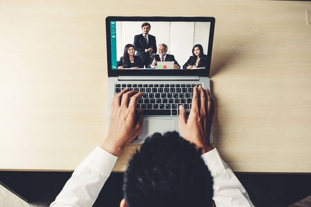 Video call business people meeting on virtual workplace or remote office. Telework conference call using smart video technology to communicate colleague in professional corporate business.の写真素材