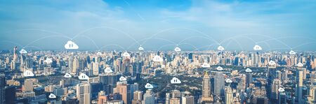 Cloud computing technology and online data storage for business network concept. Computer connects to internet server service for cloud data transfer presented in 3D futuristic graphic interface.の写真素材