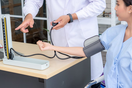 Doctor in professional uniform examining patient at hospital or medical clinic. Health care ,...