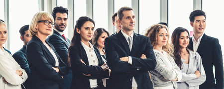 Successful business people standing together showing strong relationship of worker community. A team...