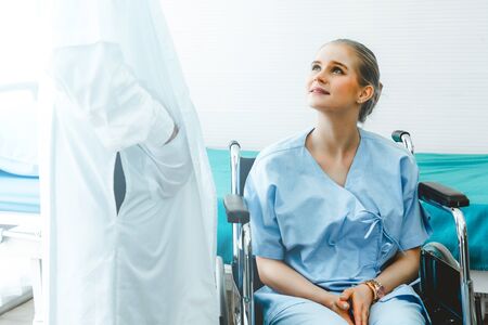Doctor in professional uniform examining patient at hospital or medical clinic. Health care , medical and doctor staff service concept.の写真素材