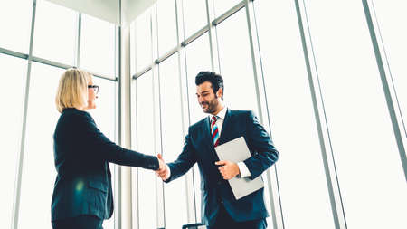 Business people handshake in corporate officeの写真素材