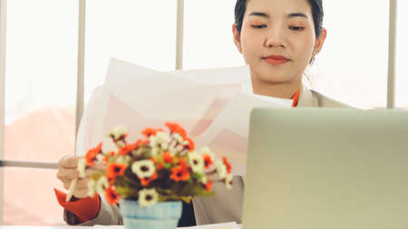 Business people working at table in modern officeの写真素材