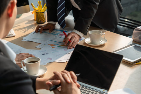 Smart businessman and businesswoman talking discussion in group meeting at office table in a modern...