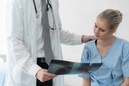 Doctor and unhappy patient at hospital or medical clinicの写真素材