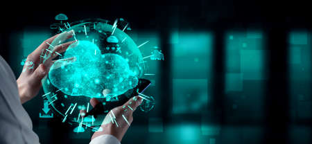 Cloud computing technology and online data storage for business network concept. Computer connects to internet server service for cloud data transfer presented in 3D futuristic graphic interface.の写真素材