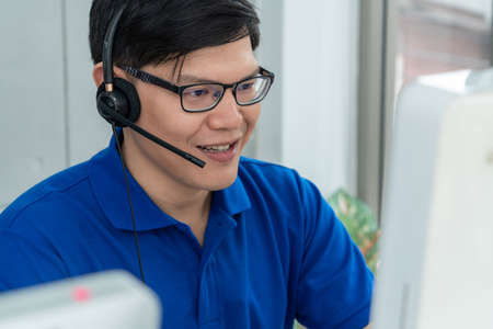 Business people wearing headset working in officeの写真素材