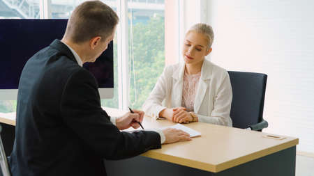 Job seeker in job interview meeting with manager and interviewer at corporate office. The young interviewee seeking for a professional career job opportunity . Human resources and recruitment concept.の写真素材