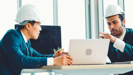 Engineer and architect meeting at office table about engineering and architecture project planning .の写真素材