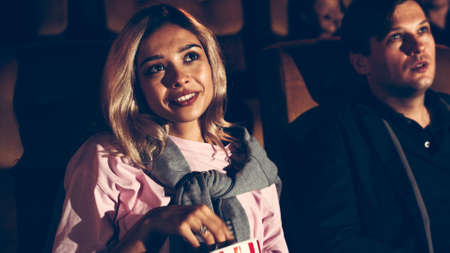 People audience watching movie in the movie theater cinema. Group recreation activity and entertainment concept.の写真素材