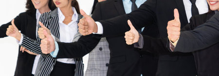 Successful business people standing together showing strong relationship of worker community. A team of businessman and businesswoman expressing a strong group teamwork at the modern office.の写真素材