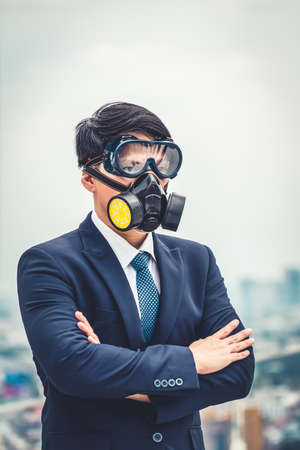 Young office worker with face mask quarantine from coronavirus or COVID-19. Concept of protective working environment to reopen business and stop spreading of coronavirus or COVID-19.の写真素材