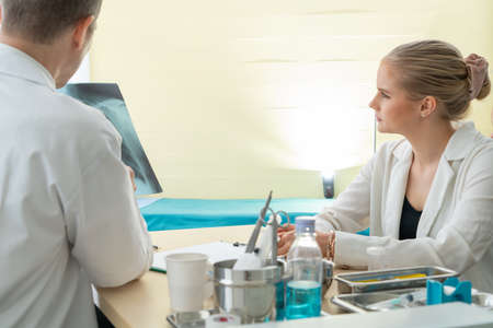 Doctor in professional uniform examining patient at hospital or medical clinic. Health care , medical and doctor staff service concept.の写真素材