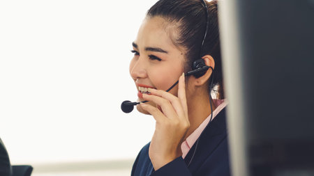 Business people wearing headset working in office to support remote customer or colleague. Call...
