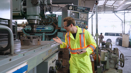 Smart factory worker using machine in factory workshop . Industry and engineering concept.