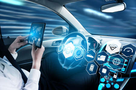 Driverless car interior with futuristic dashboard for autonomous control system . Inside view of cockpit HUD technology using AI artificial intelligence sensor to drive car without people driver .の販売画像