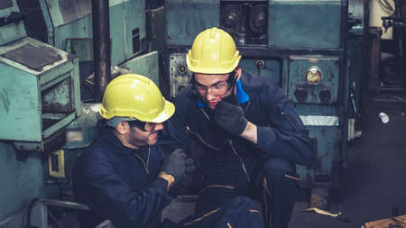 Factory worker injured by accident while using machine in factory in an unsafe condition . Maintenance worker in control room of factory . Safety first concept .の写真素材