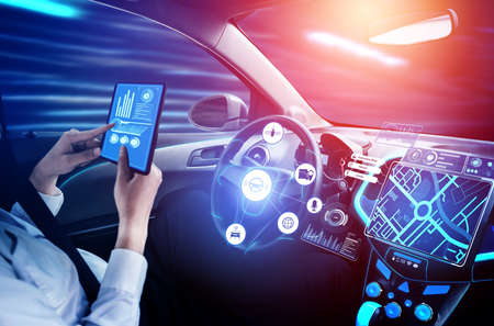 Driverless car interior with futuristic dashboard for autonomous control system . Inside view of cockpit HUD technology using AI artificial intelligence sensor to drive car without people driver .の販売画像