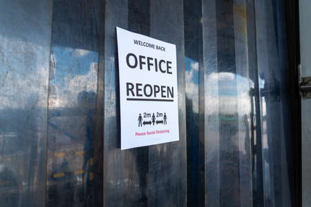 Sign caution in factory warning to industry labor worker to prevent Covid-19 Coronavirus spreading during job business reopening period after epidemic crisis . Working safely concept .の写真素材