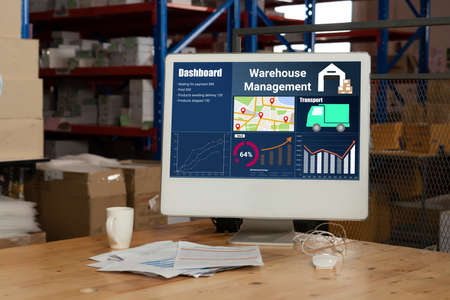 Warehouse management software application in computer for real time monitoring of goods package delivery . PC screen showing smart inventory dashboard for storage and supply chain distribution .の写真素材