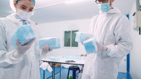 Face mask production line in modern factory . Concept of covid-19 coronavirus 2019 provention .