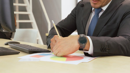 Business people wearing headset working in office to support remote customer or colleague. Call...