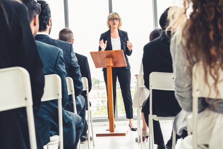 Group of business people meeting in a seminar conference . Audience listening to instructor in...