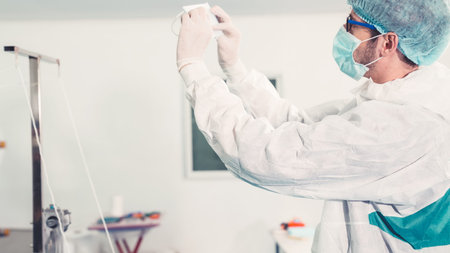 Face mask production line in modern factory . Concept of covid-19 coronavirus 2019 provention .