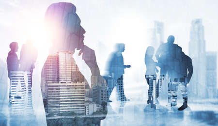 Abstract image of many business people together in group on background of city view with office building showing partnership success of business deal. Concept of employee teamwork, trust and agreementの写真素材