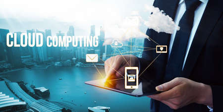 Cloud computing technology and online data storage for global data sharing. Computer connects to internet network server service for cloud data transfer presented in 3D futuristic graphic interface.の写真素材