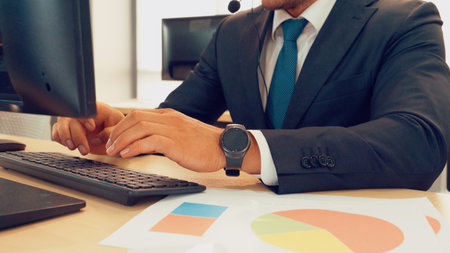 Business people wearing headset working in office to support remote customer or colleague. Call...