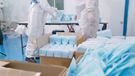Face mask production line in modern factory . Concept of covid-19 coronavirus 2019 provention .の写真素材