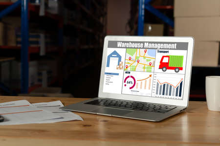 Warehouse management software application in computer for real time monitoring of goods package delivery . PC screen showing smart inventory dashboard for storage and supply chain distribution .の写真素材