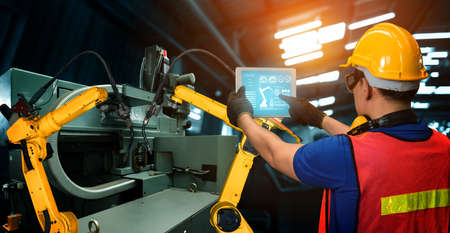 Smart industry robot arms for digital factory production technology showing automation manufacturing process of the Industry 4.0 or 4th industrial revolution and IOT software to control operation .の写真素材