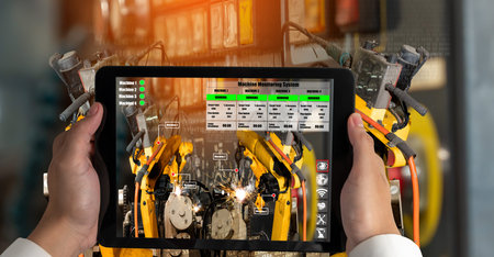 Engineer controls robotic arms by augmented reality industry technology application software. Smart...