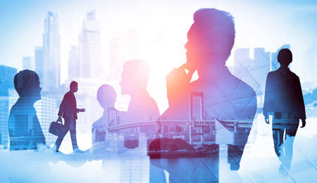 Abstract image of many business people together in group on background of city view with office building showing partnership success of business deal. Concept of employee teamwork, trust and agreementの写真素材