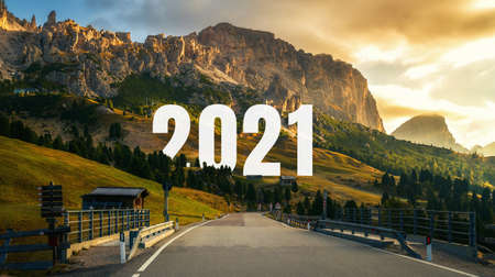 2021 New Year road trip travel and future vision concept . Nature landscape with highway road leading forward to happy new year celebration in the beginning of 2021 for fresh and successful start .の写真素材
