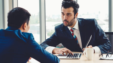 Job seeker in job interview meeting with manager and interviewer at corporate office. The young...
