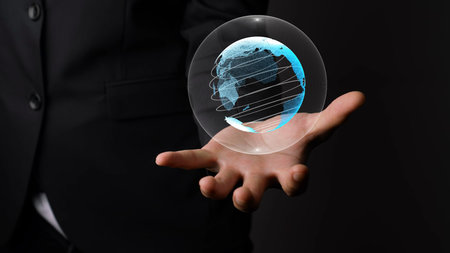 Human hand holding earth globe holographic technology . Futuristic visualization for virtual reality...