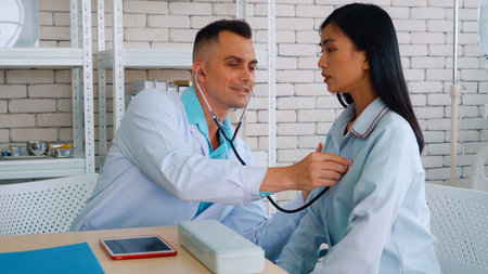 Doctor in professional uniform examining patient at hospital or medical clinic. Health care ,...