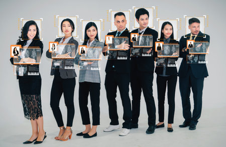 Facial recognition technology scan and detect people face for identification . Future concept interface showing digital biometric security system that analyze human face to verify personal data .の写真素材
