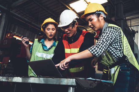 Factory job workers working and discussing manufacturing plan in the factory . Industry and engineering concept .の写真素材